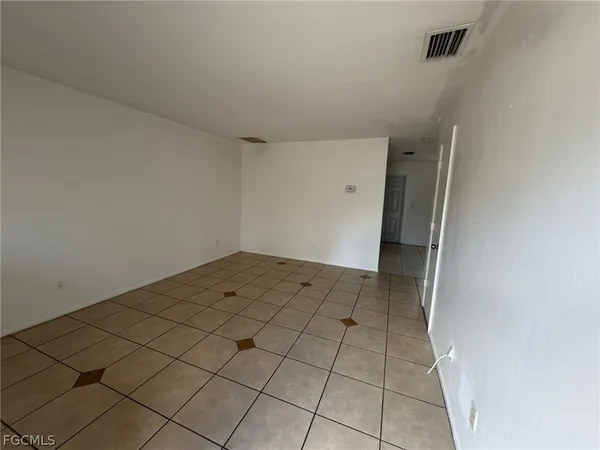 a view of a room with white walls