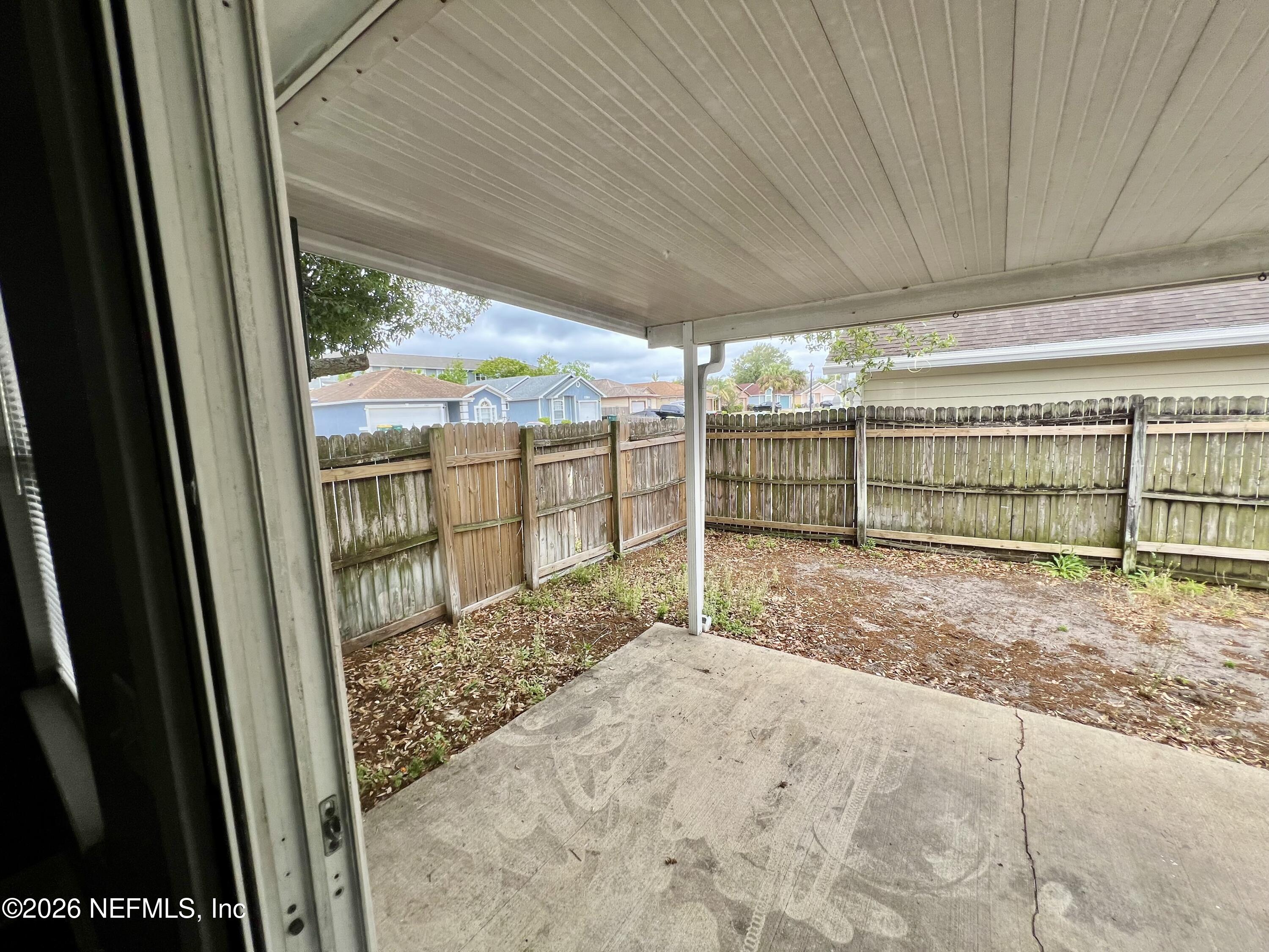 8778 Buzz Court Jacksonville, FL 32216 - Photo 18 of 22 a view of outdoor space with wooden fence