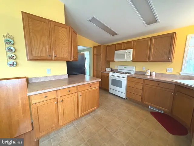 a kitchen with a stove and cabinets