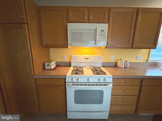 a view of a hallway with a room