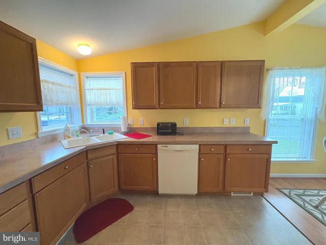 a bathroom with a sink a washer and dryer
