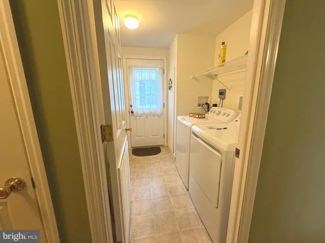 a view of a bathroom from a door