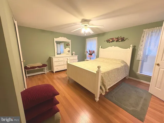 a bathroom with a bathtub sink mirror and toilet