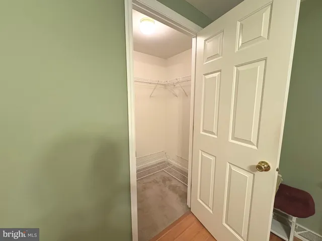 a bathroom with a tub a sink a mirror and a shower