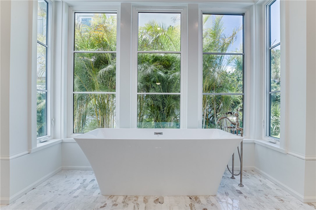 1375 Sandy Lane Vero Beach, FL 32963 - Photo 11 of 36 a white bath tub sitting in a window
