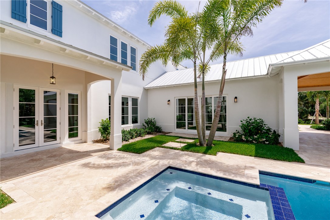 1375 Sandy Lane Vero Beach, FL 32963 - Photo 14 of 36 a front view of a house with garden