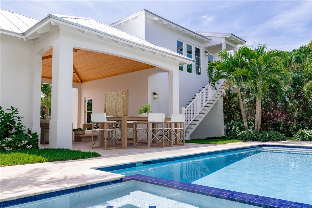 1375 Sandy Lane Vero Beach, FL 32963 - Photo 16 of 36 a view of a house with swimming pool and sitting area