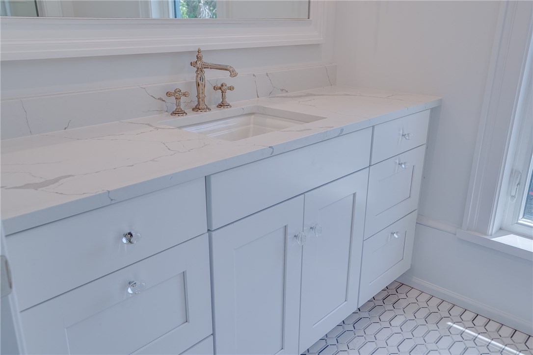 1375 Sandy Lane Vero Beach, FL 32963 - Photo 20 of 36 a bathroom with a sink and cabinets