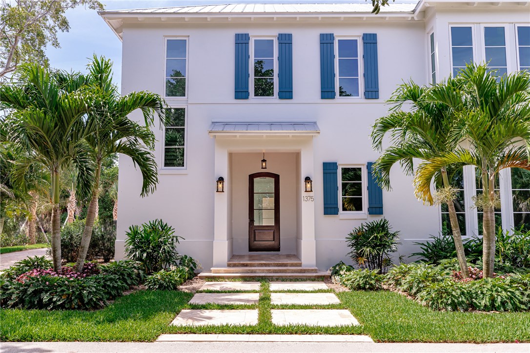1375 Sandy Lane Vero Beach, FL 32963 - Photo 2 of 36 a front view of a house with yard