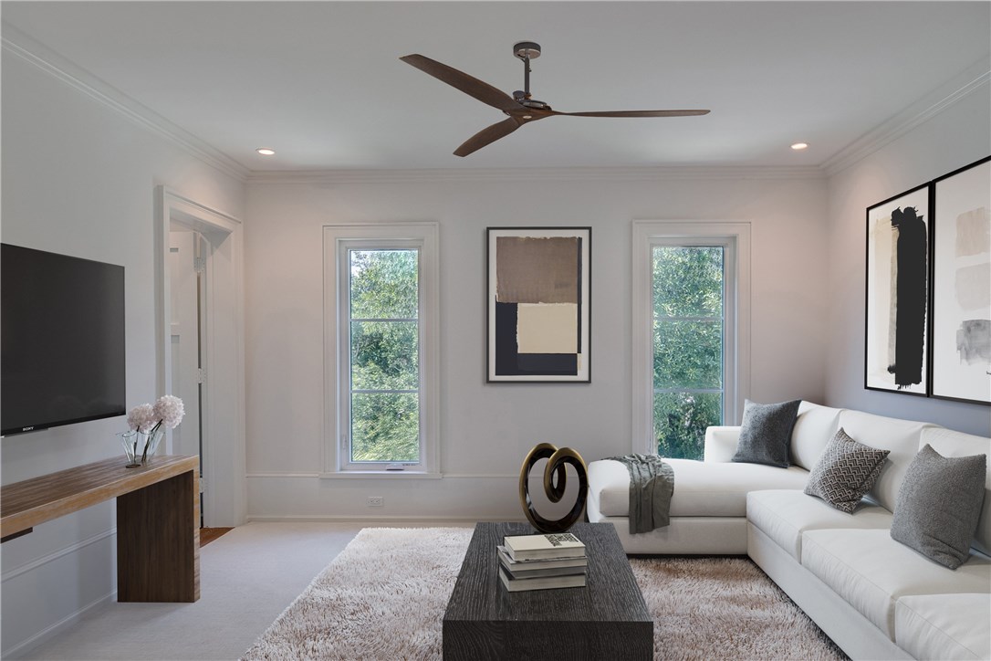 1375 Sandy Lane Vero Beach, FL 32963 - Photo 24 of 36 a living room with furniture a window and a flat screen tv