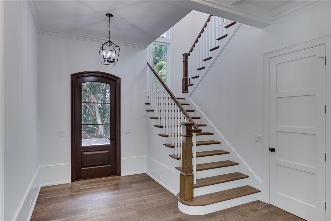 1375 Sandy Lane Vero Beach, FL 32963 - Photo 3 of 36 a view of entryway with stairs and wooden floor