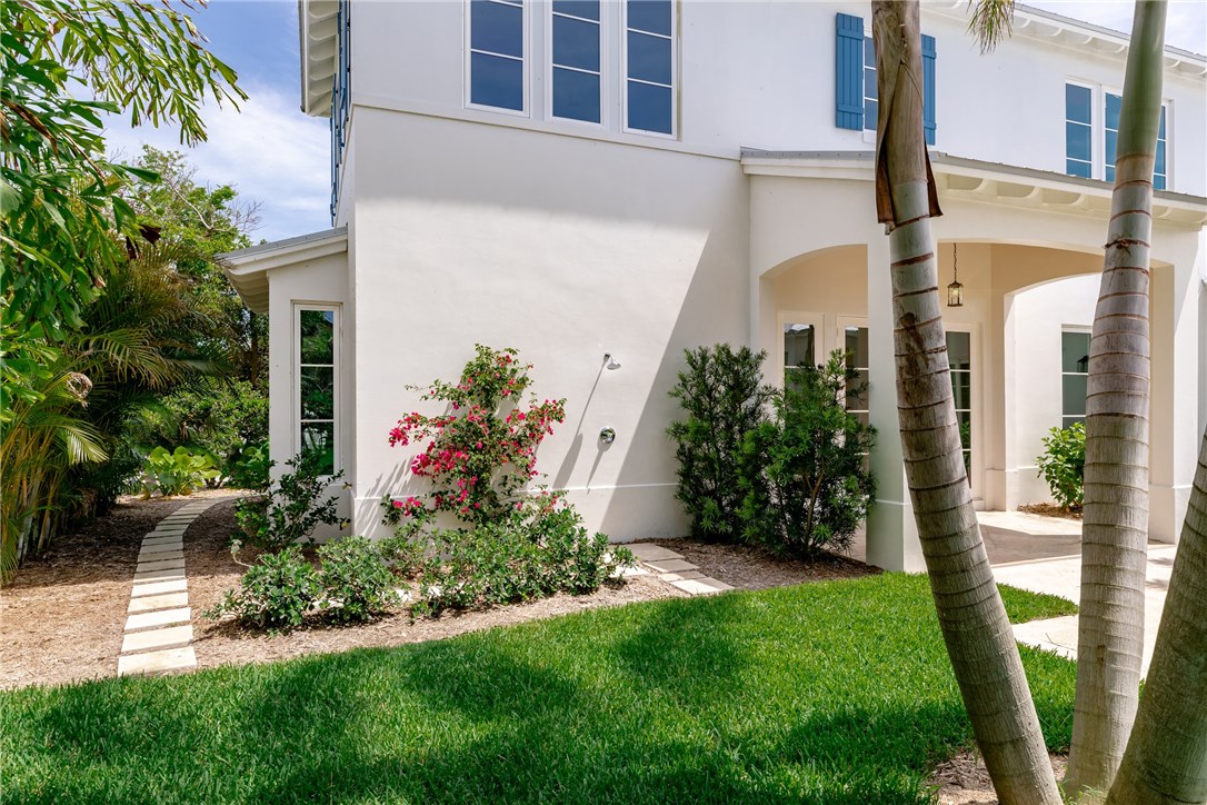 1375 Sandy Lane Vero Beach, FL 32963 - Photo 32 of 36 a front view of a house with garden
