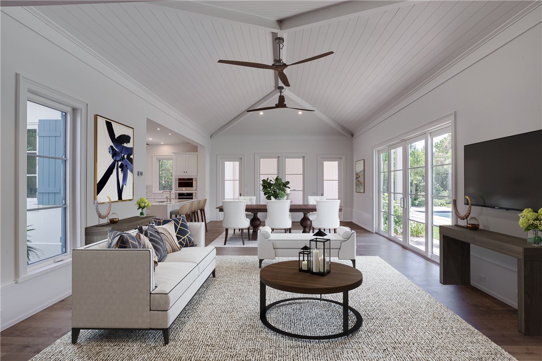 1375 Sandy Lane Vero Beach, FL 32963 - Photo 4 of 36 a living room with furniture a flat screen tv and a large window