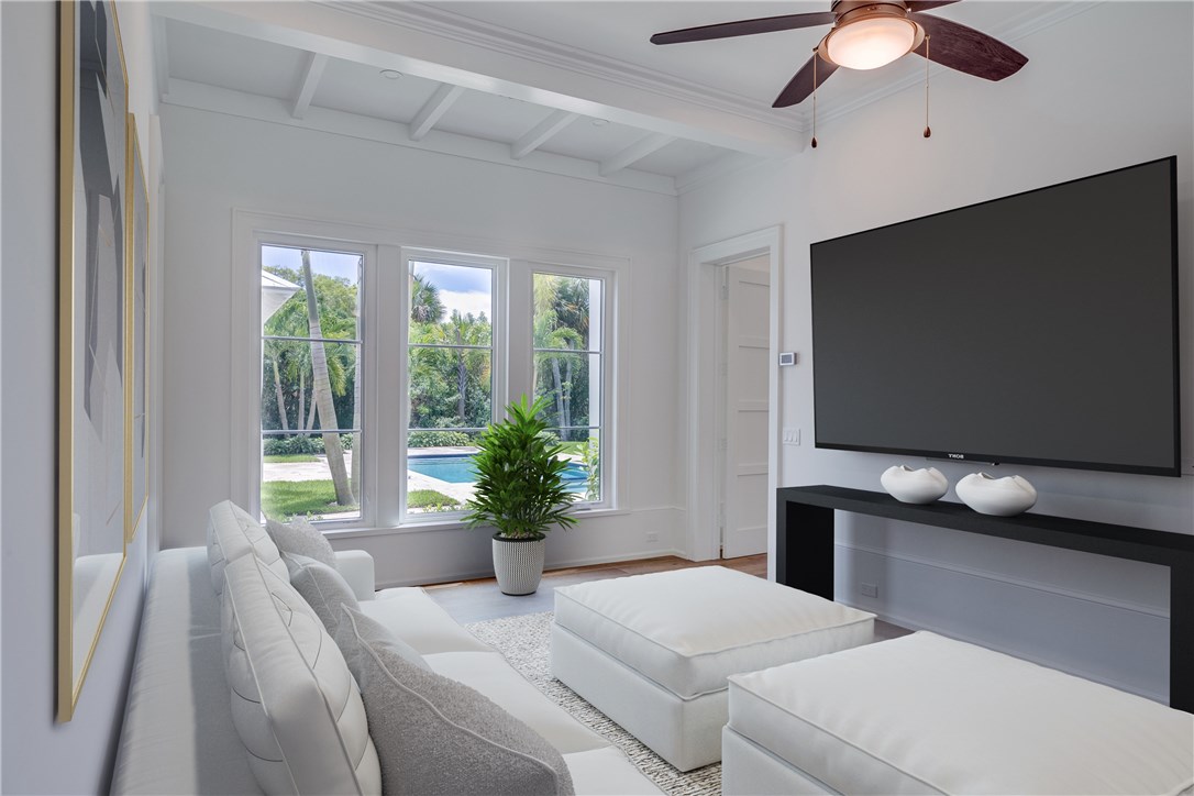 1375 Sandy Lane Vero Beach, FL 32963 - Photo 9 of 36 a bedroom with a bed and a flat screen tv