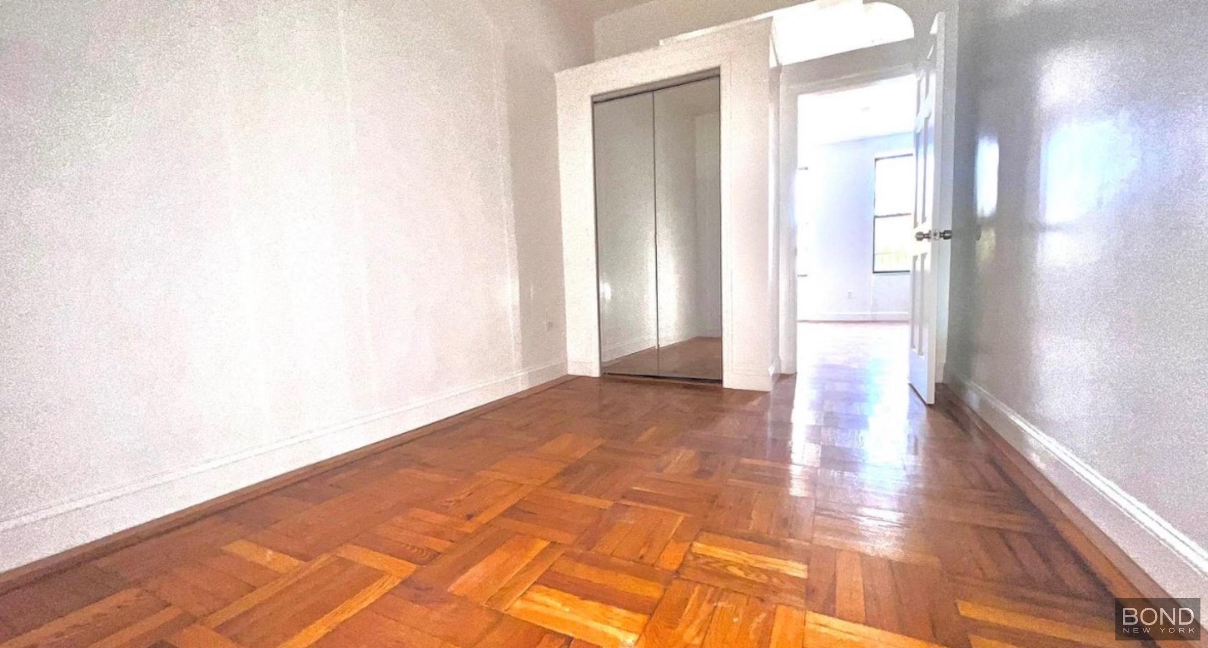 842 Bushwick Avenue, Unit 2R Brooklyn, NY 11221 - Photo 5 of 8 a view of an empty room and wooden floor