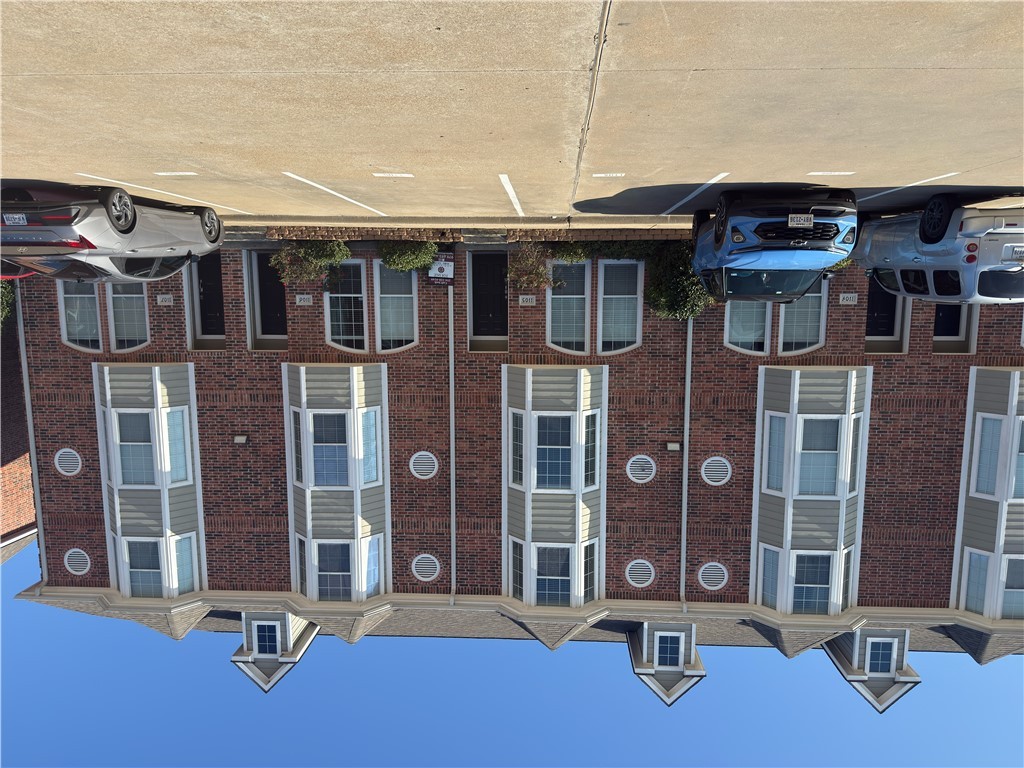 a front view of a building with a street