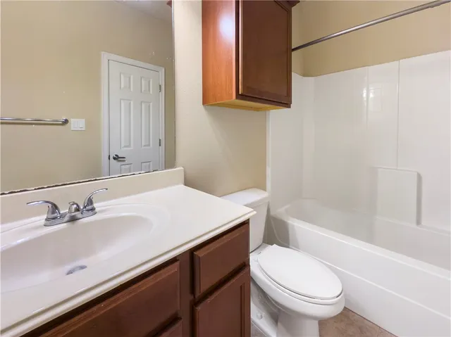 a bathroom with a sink a toilet and a bathtub