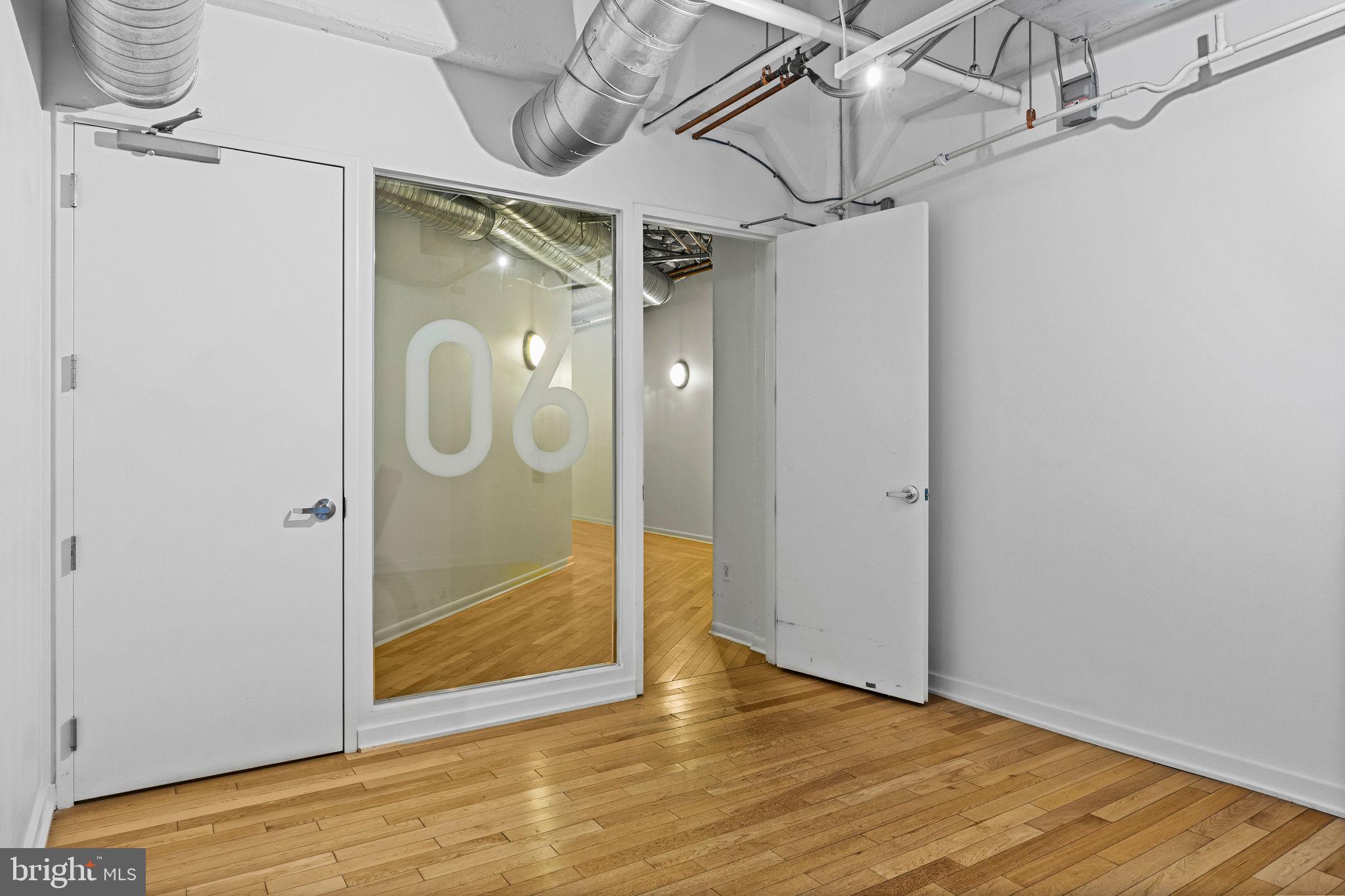 2200-28 Arch Street, Unit 612 Philadelphia, PA 19103 - Photo 18 of 43 a view of a hallway with wooden floor