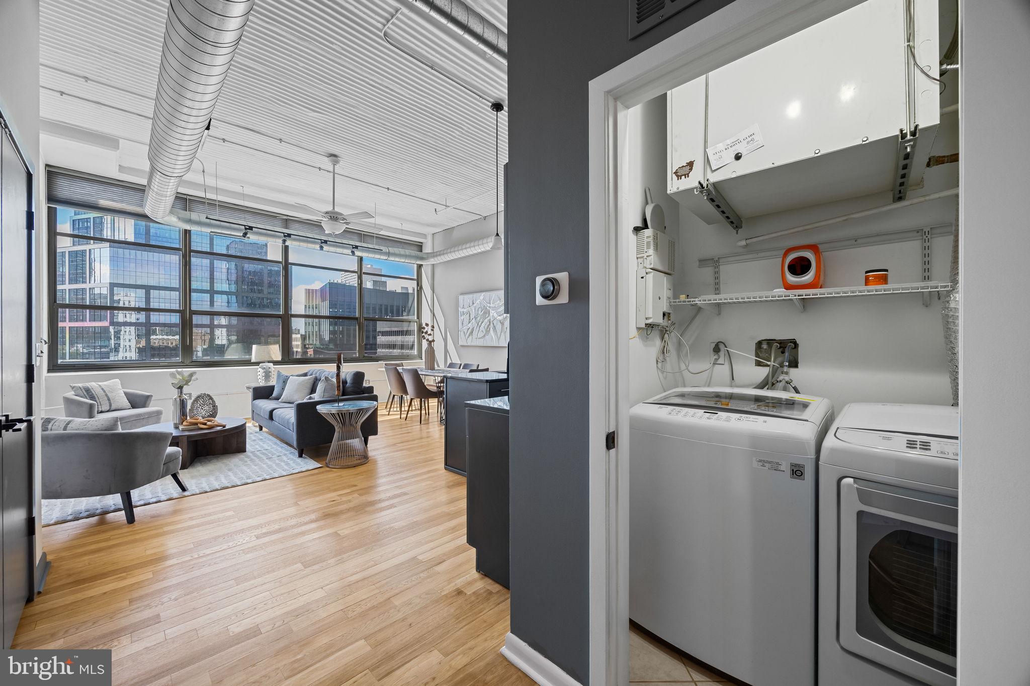 2200-28 Arch Street, Unit 612 Philadelphia, PA 19103 - Photo 21 of 43 a living room with furniture and a view of kitchen