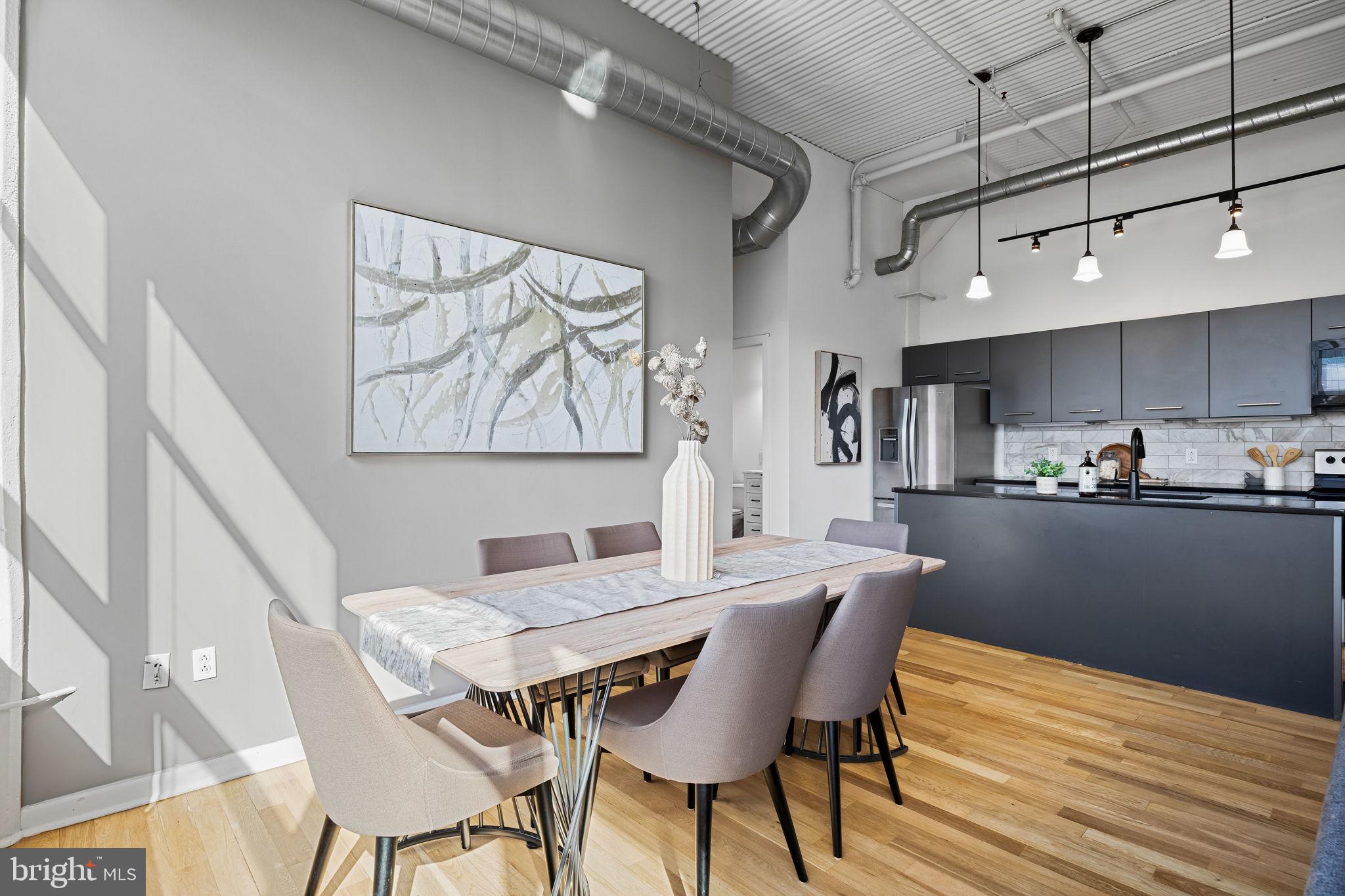 2200-28 Arch Street, Unit 612 Philadelphia, PA 19103 - Photo 24 of 43 a dining room with furniture and window