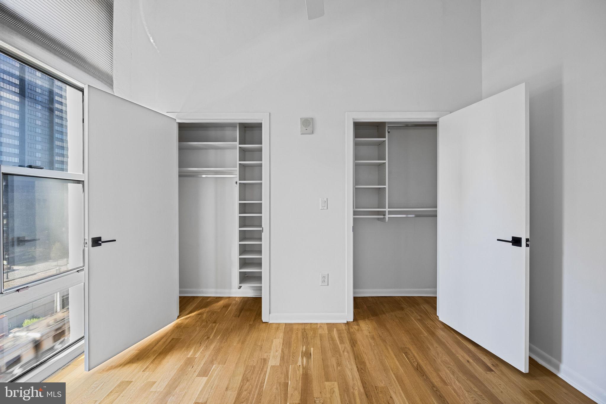 2200-28 Arch Street, Unit 612 Philadelphia, PA 19103 - Photo 28 of 43 a view of empty room with wooden floor and cabinet