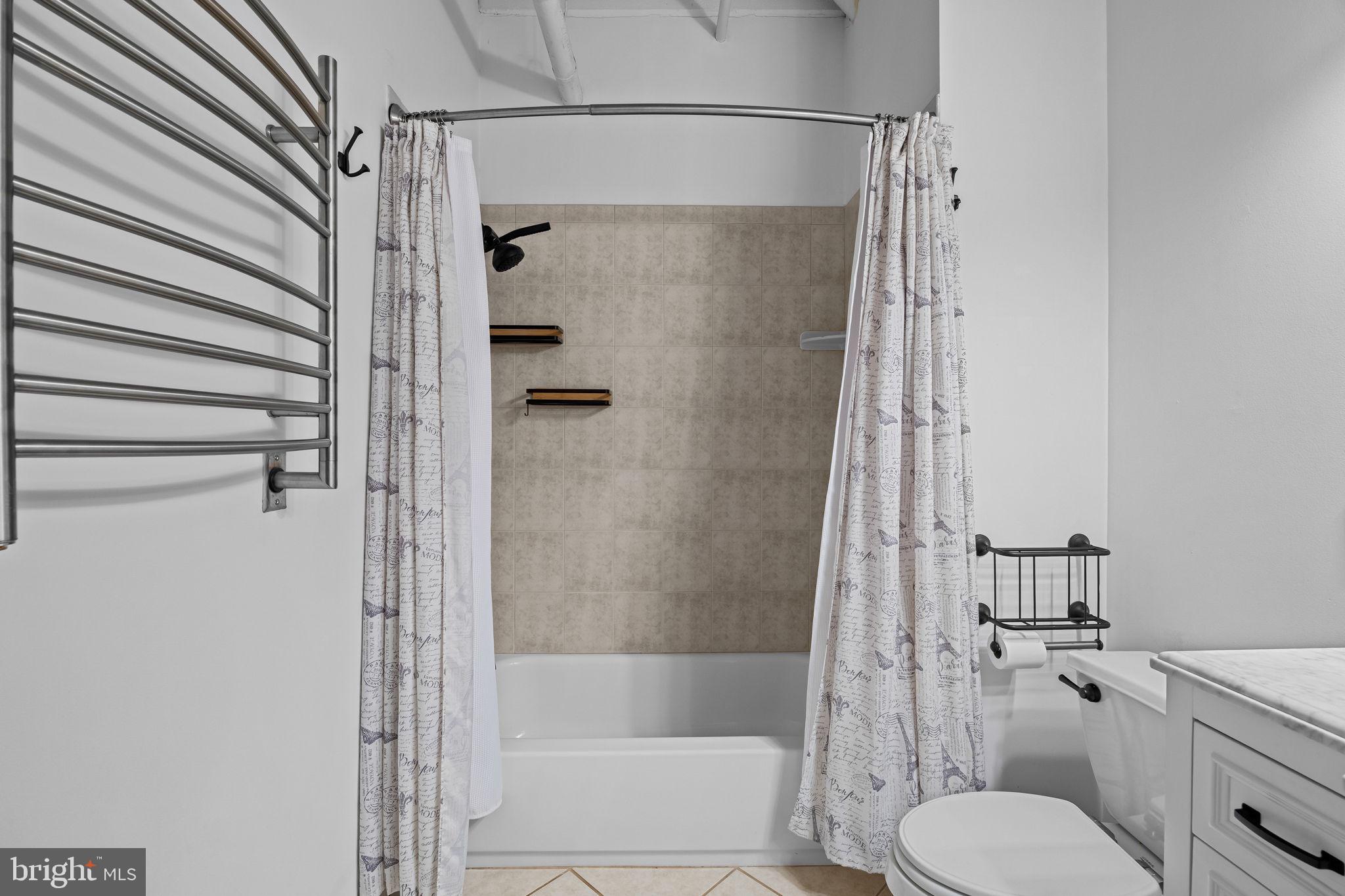 2200-28 Arch Street, Unit 612 Philadelphia, PA 19103 - Photo 31 of 43 a bathroom with a shower and toilet