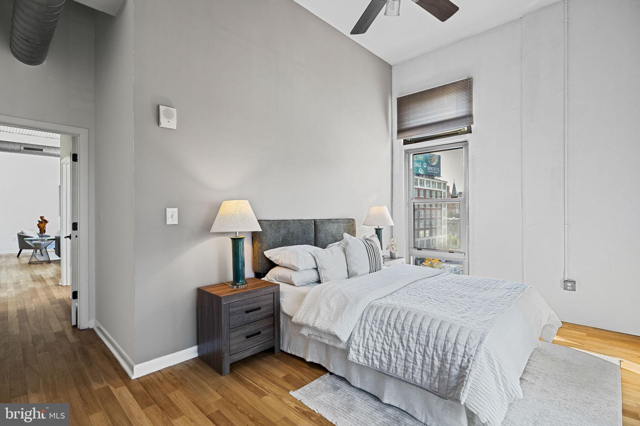 2200-28 Arch Street, Unit 612 Philadelphia, PA 19103 - Photo 33 of 43 a bedroom with a bed and wooden floor