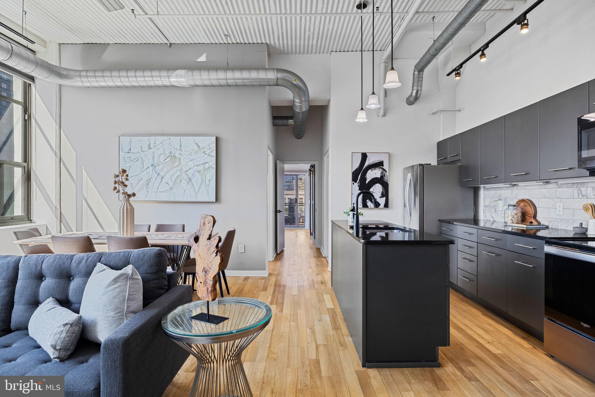 2200-28 Arch Street, Unit 612 Philadelphia, PA 19103 - Photo 7 of 43 a kitchen with stainless steel appliances granite countertop a stove and cabinets