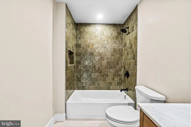 a white house with trees in front of it