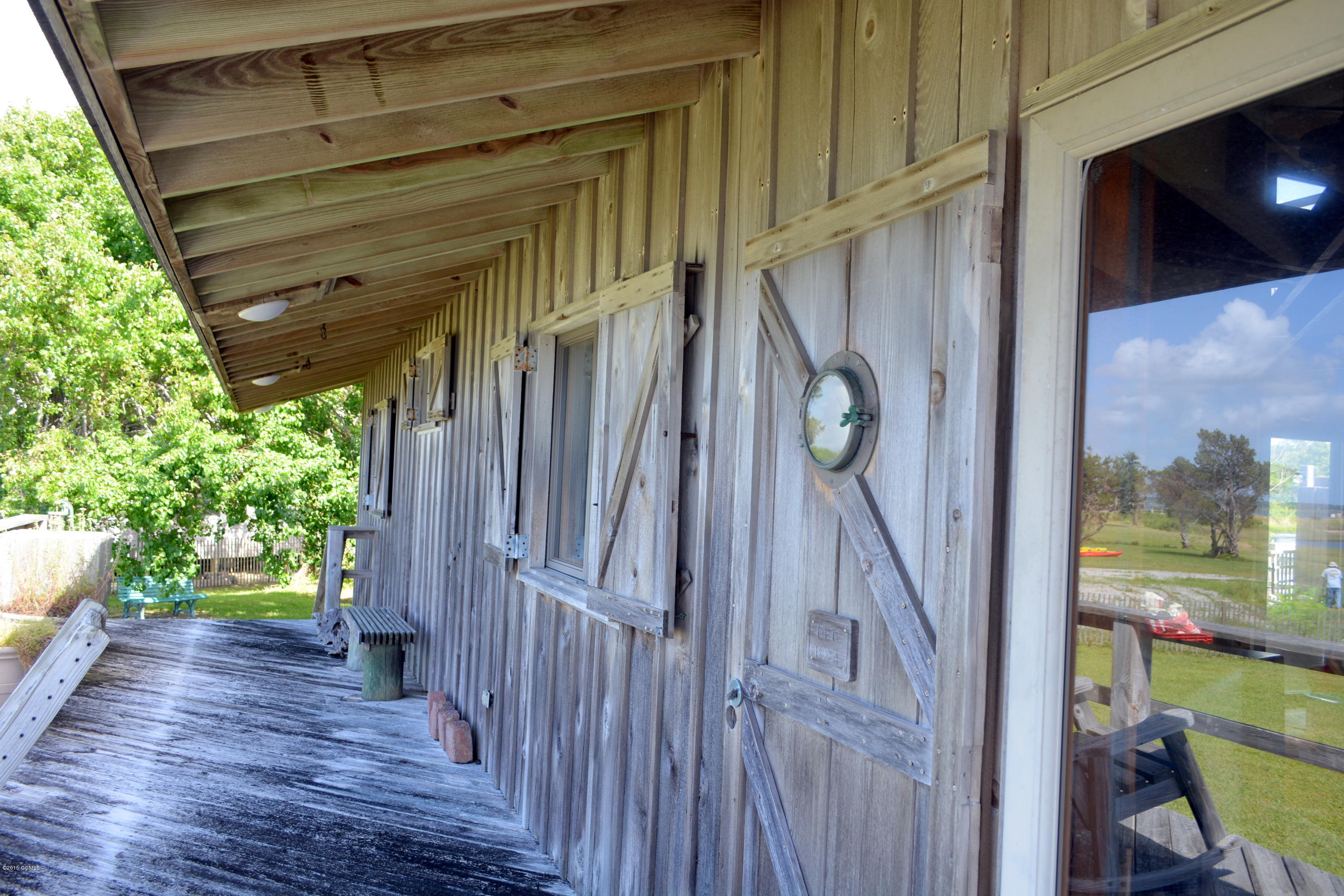 308 Harbour Point Road Beaufort, NC 28516 - Photo 6 of 28 Overhang with Hurricane Shutters
