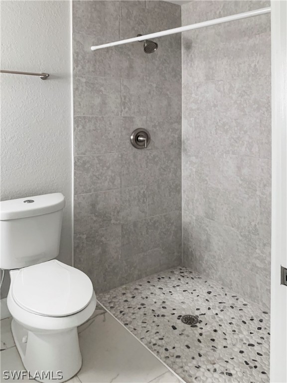 7418 Albany Road, Unit 7418 Fort Myers, FL 33967 - Photo 11 of 11 a bathroom with a toilet and a shower