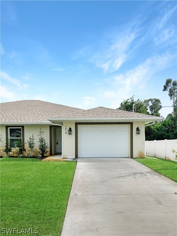 7418 Albany Road, Unit 7418 Fort Myers, FL 33967 - Photo 2 of 11 a front view of house with yard and green space
