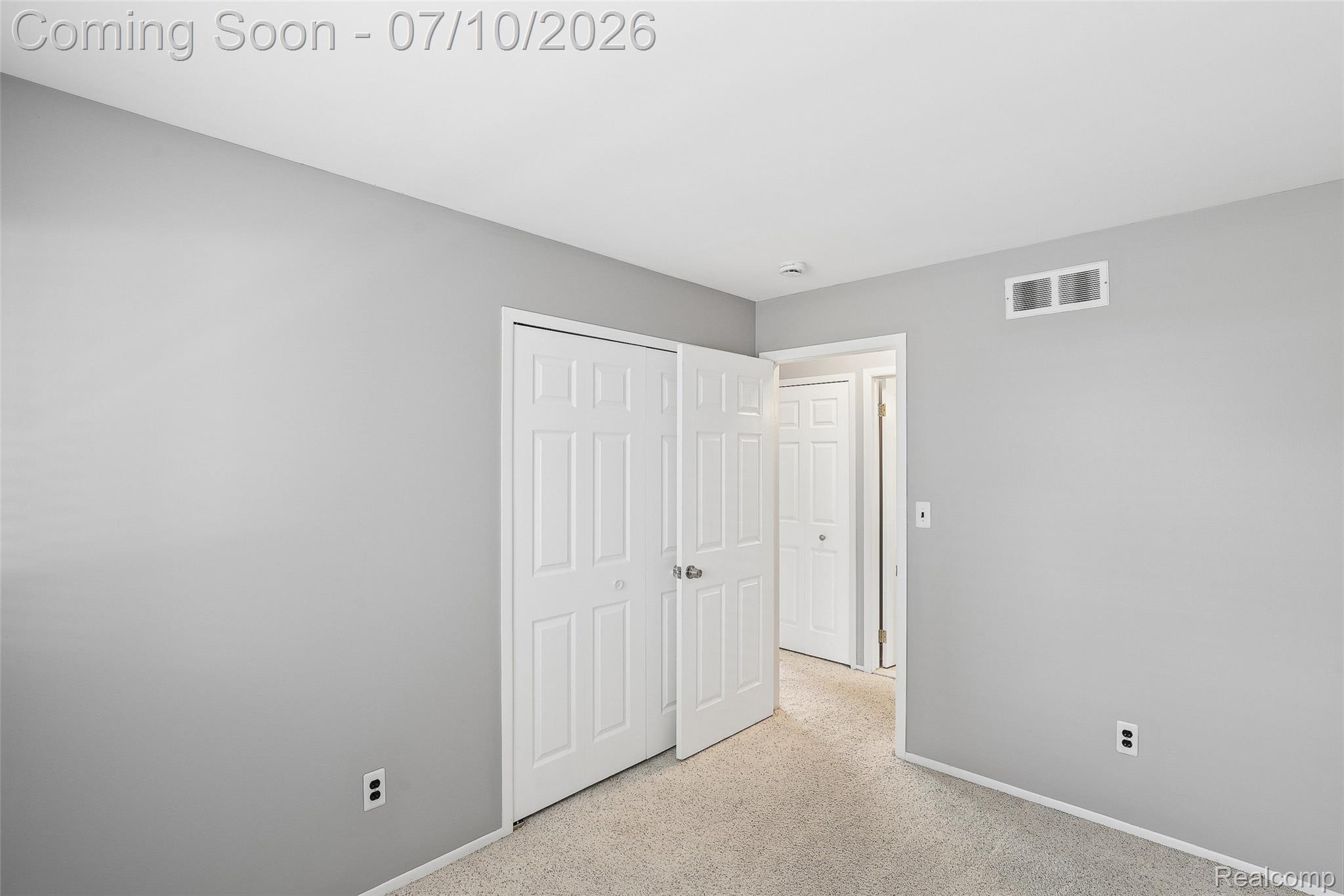 42698 Keystone Canton, MI 48187 - Photo 11 of 33 Neutral-toned interior room featuring light gray painted walls and matching baseboards