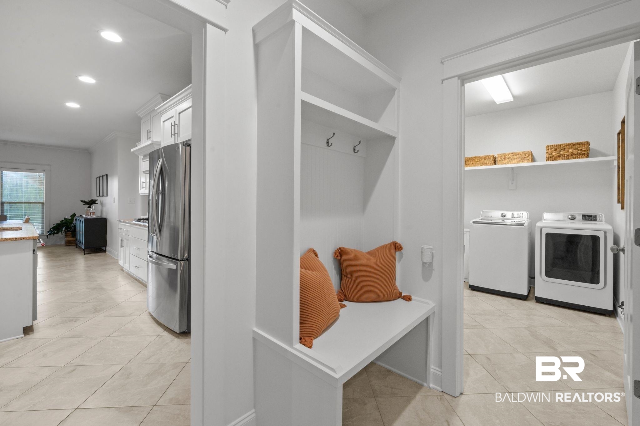 418 Fortune Drive Fairhope, AL 36532 - Photo 45 of 63 Mudroom with light tile patterned flooring and washer and clothes dryer