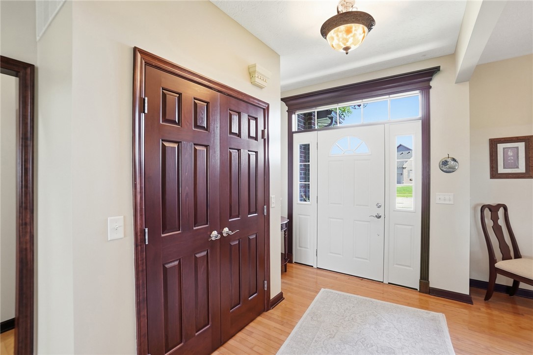 710 Governors Road Troy, OH 45373 - Photo 6 of 56 Step into this welcoming entrance foyer with polished hardwood floors and natural light.