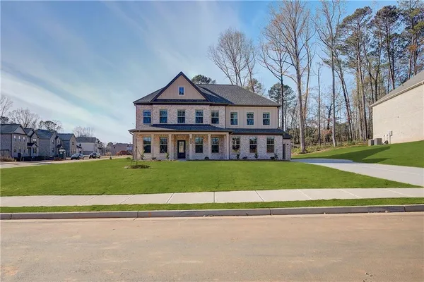 a front view of a house with a yard