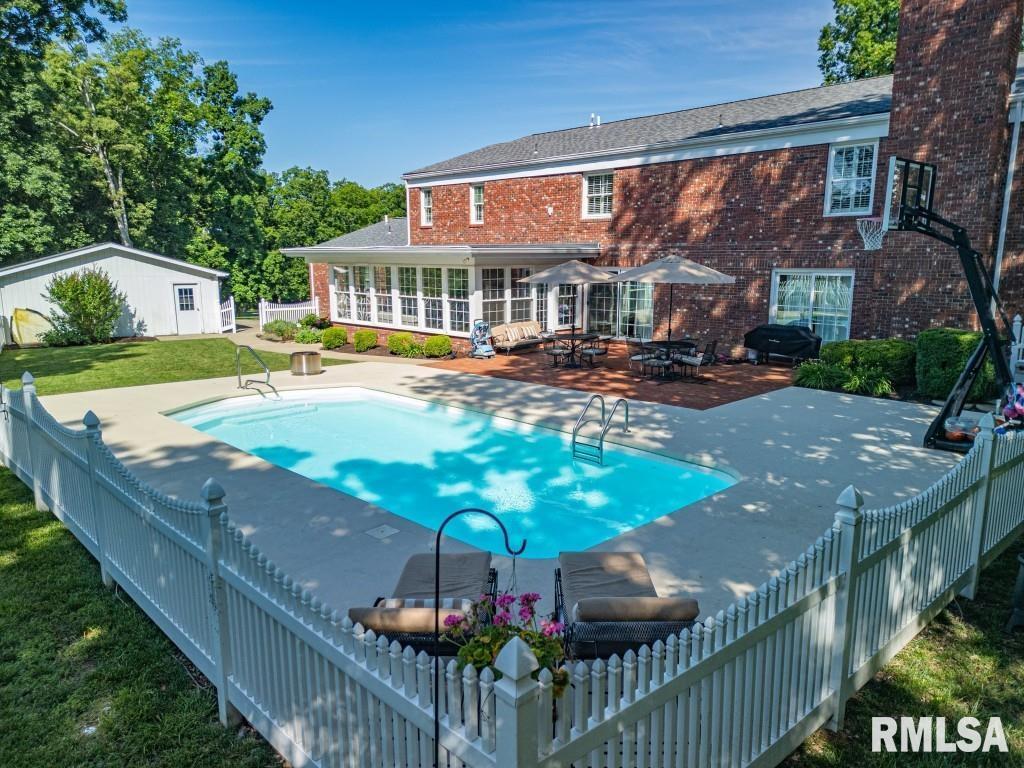 616 Seville Drive Mount Vernon, IL 62864 - Photo 12 of 62 a view of a house with swimming pool and sitting area