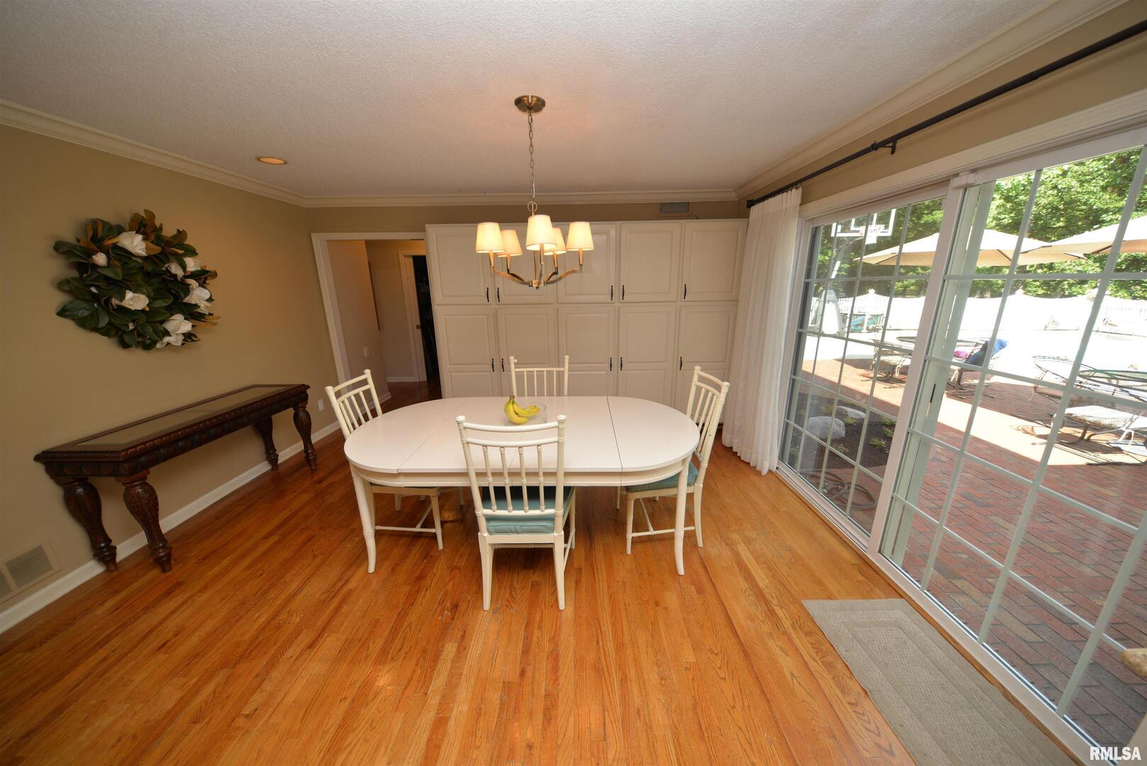 616 Seville Drive Mount Vernon, IL 62864 - Photo 28 of 62 a view of a dining room with furniture window and wooden floor
