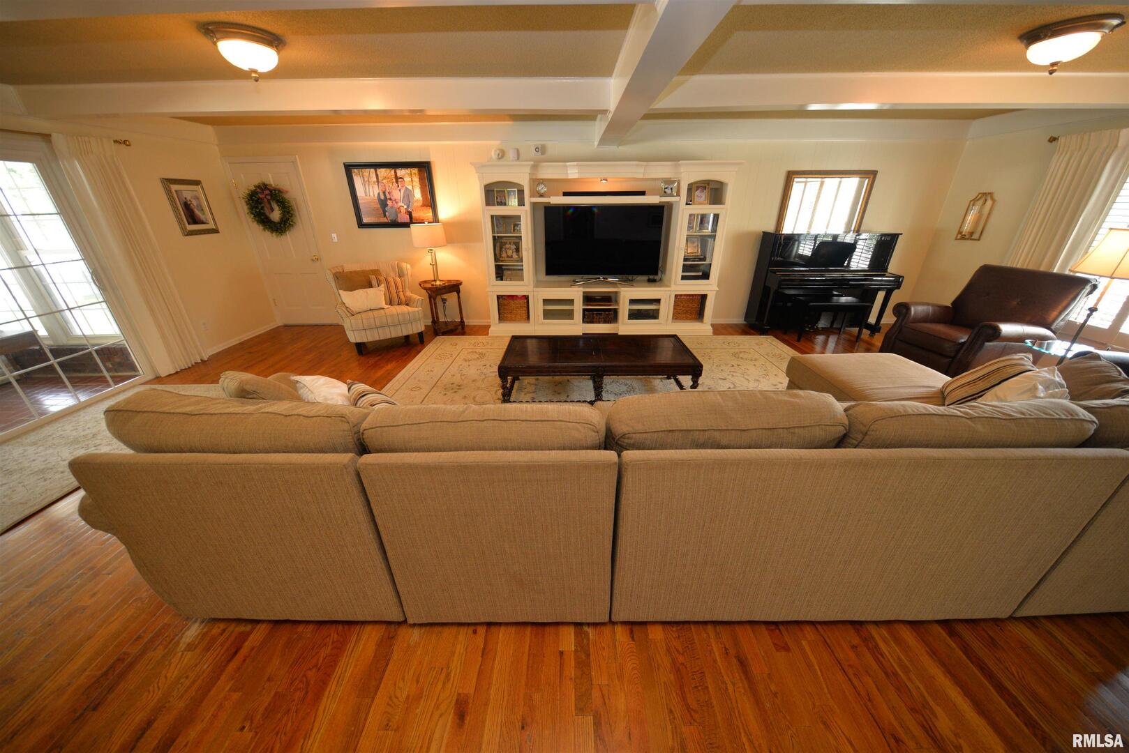 616 Seville Drive Mount Vernon, IL 62864 - Photo 32 of 62 a living room with furniture and a flat screen tv
