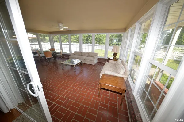 a room with lots of furniture and wooden floor