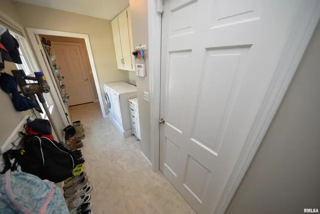 a bathroom with a sink mirror vanity and toilet