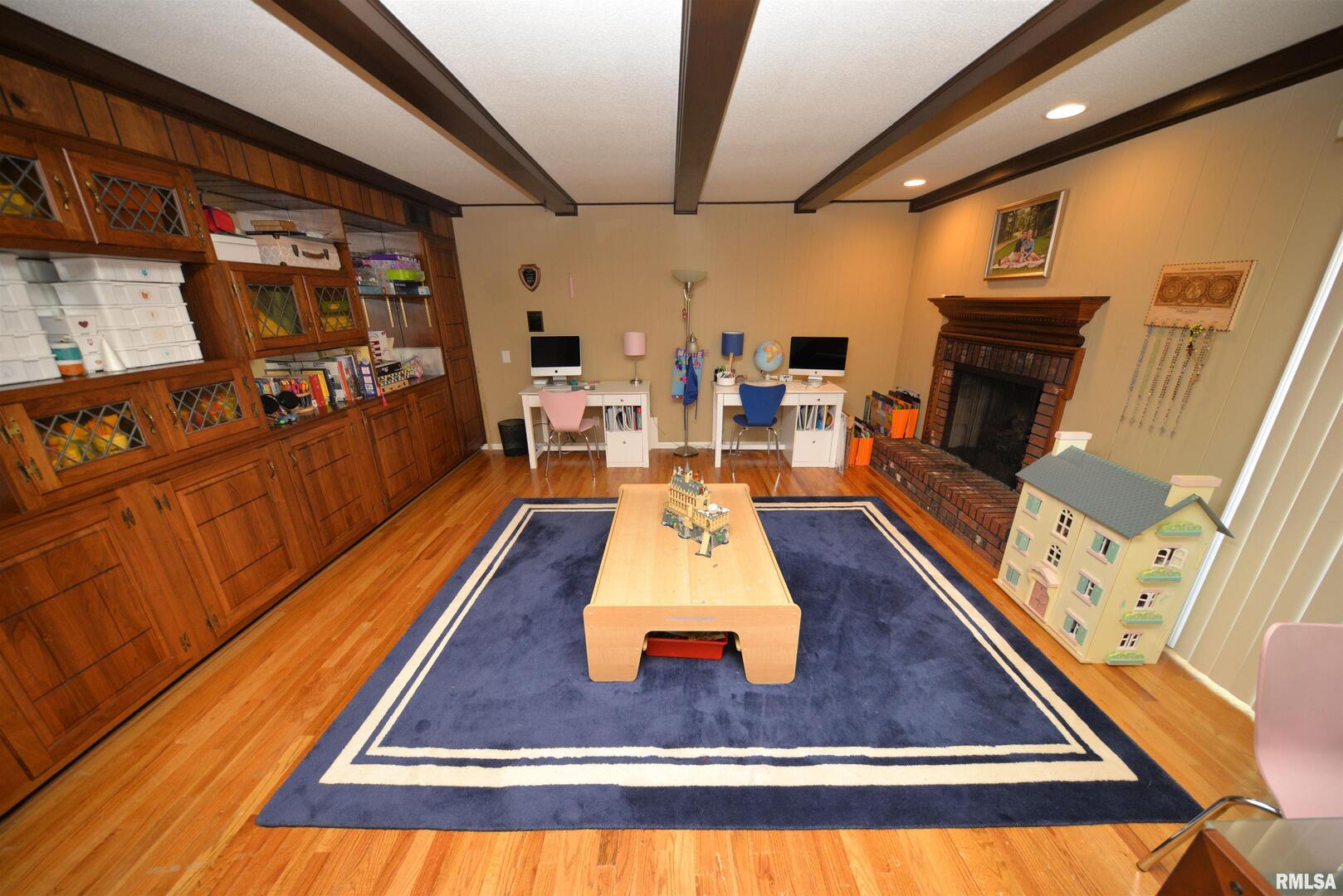 616 Seville Drive Mount Vernon, IL 62864 - Photo 39 of 62 a room with lots of furniture and wooden floor