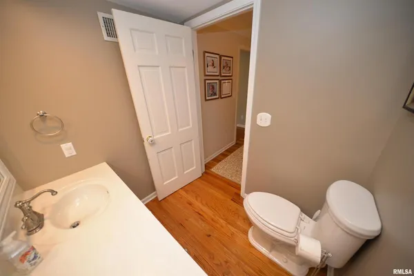 a spacious bathroom with a sink and a shower