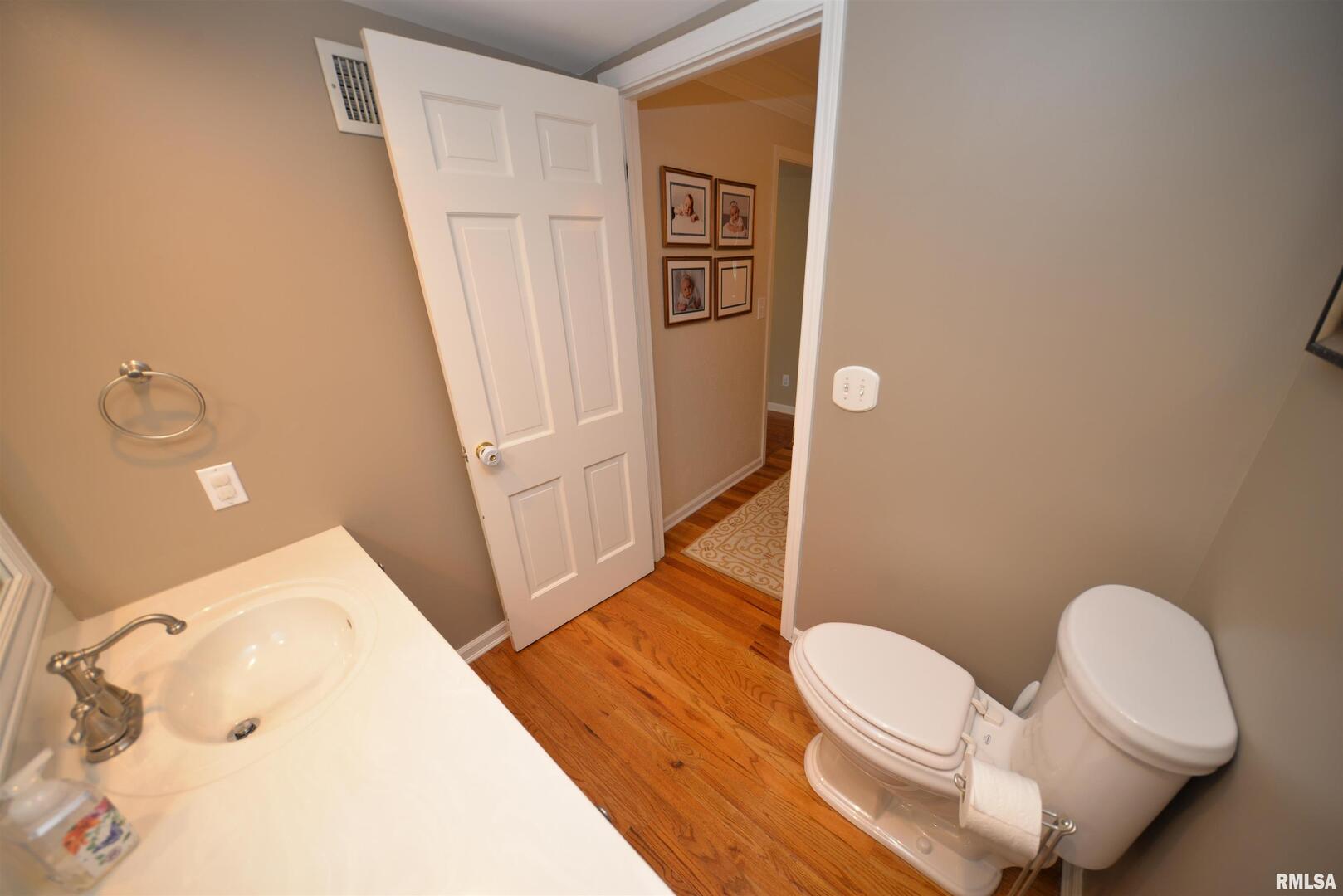 616 Seville Drive Mount Vernon, IL 62864 - Photo 40 of 62 a bathroom with a sink mirror vanity and toilet
