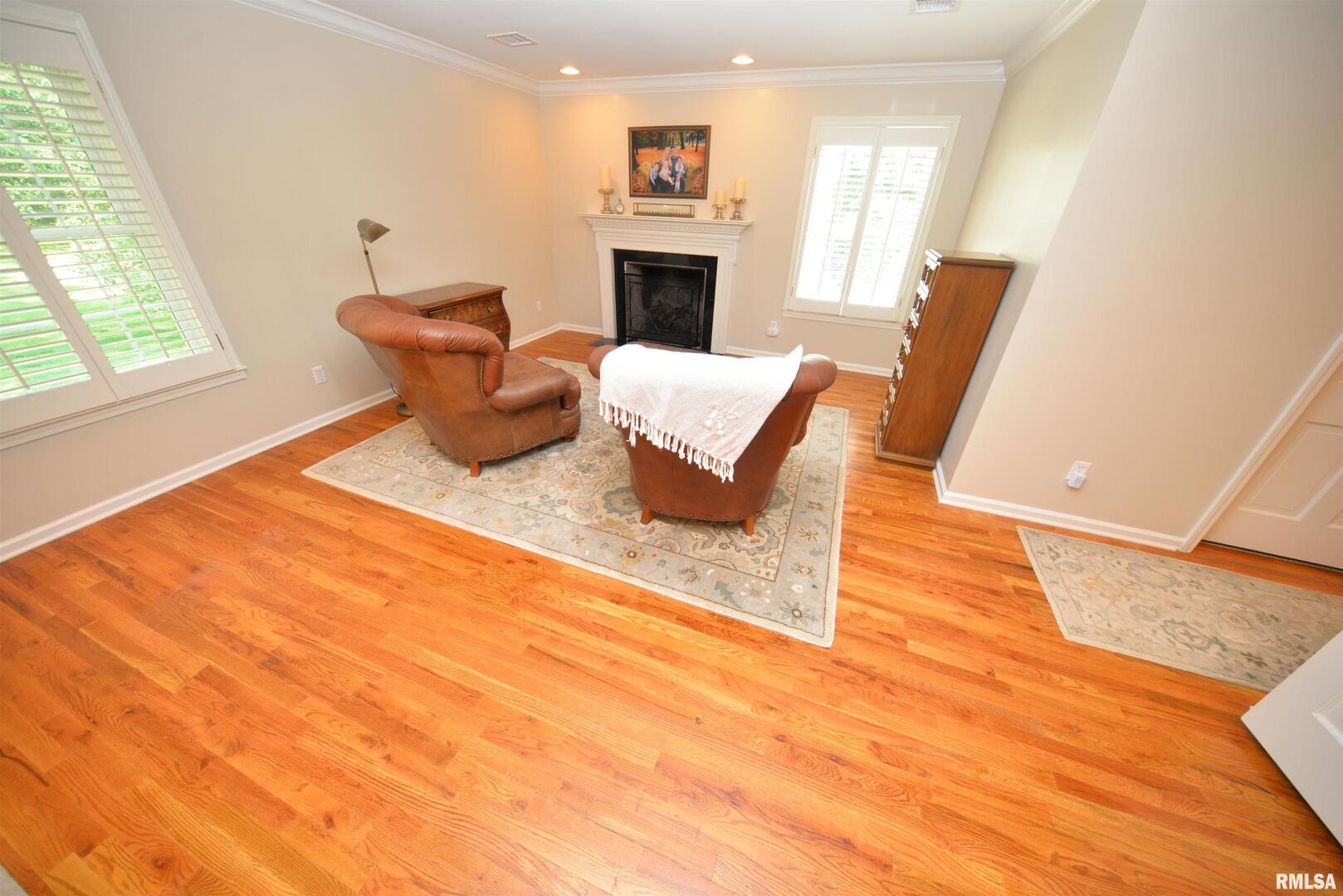 616 Seville Drive Mount Vernon, IL 62864 - Photo 44 of 62 a living room with furniture a fireplace and a large window