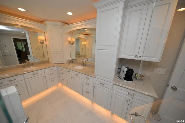 a kitchen with stainless steel appliances a refrigerator and a stove top oven