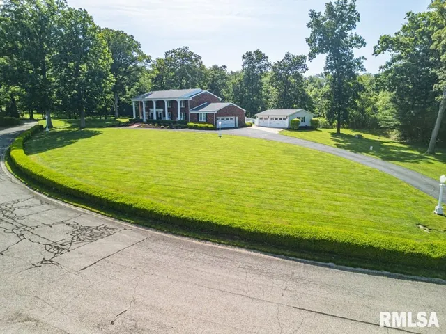 a view of a house with a yard patio and a patio