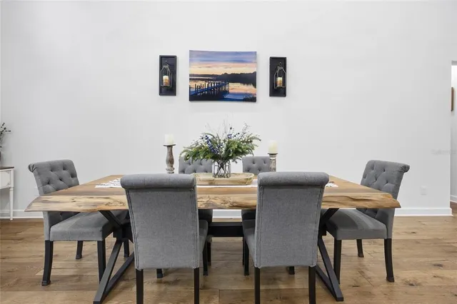 a stove top oven sitting inside of a kitchen and white cabinets