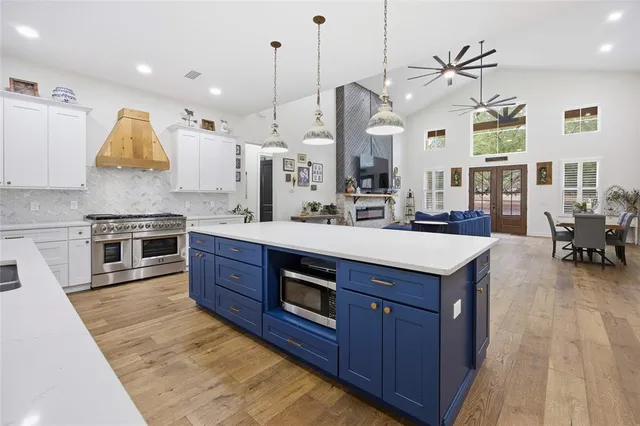 a view of a workspace with furniture and wooden floor