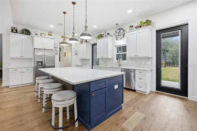 a bedroom with a bed and cabinets